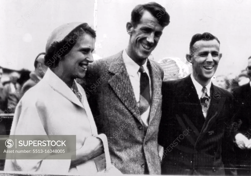 Below, Sir Edmund Hillary is welcomed by his sister and brother. Sir Edmund, who has been ill with dysentery, expects to stay a month in England. July 4, 1953. 