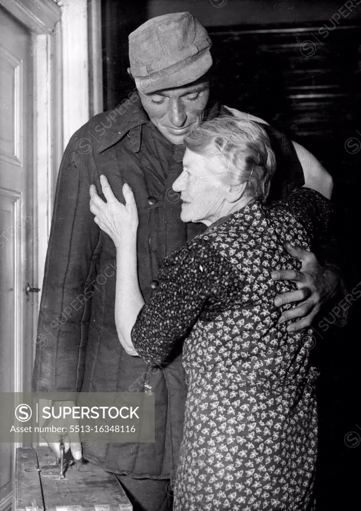 Welcome Home From Soviet Prison Camp. Kurt Mandelsdorff being greeted by his 79-year-old grandmother Anna Schulze after he knocked at the door for her West Berlin home. The returned wears a heavily padded Russian jacket and carries a wooden case he made in captivity for his return home. 34-year-old Kurt Mangelsdorff, former corporal if Hitler's armed ***** returned home to West Berlin September 26, after spending almost nine years of his life behind barbed wire in Soviet Russia. October 6, 1953. (Photo by Associated Press Photo).