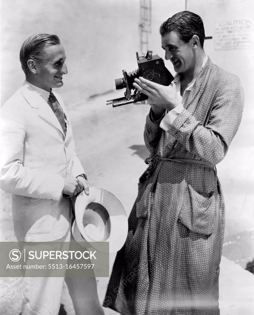 *****popular as well as the most photgraphed Olympic athsete, visits his friend Gary Cooper at the paramount studio in Hollywood only to be faced with another camera. The athlete and picture star met recently in England before Gary Cooper returned to the United States to take part in "Devil and the Deep" and "Farewell to Arms". One More Picture - Lord Burghley, Captain of the British Olympic team, visits his friend Gary Cooper at the Paramount Studio in Hollywood, where this most-photographed Olympic athlete is photographed once more. September 12, 1932. (Photo by Paramount Photo).