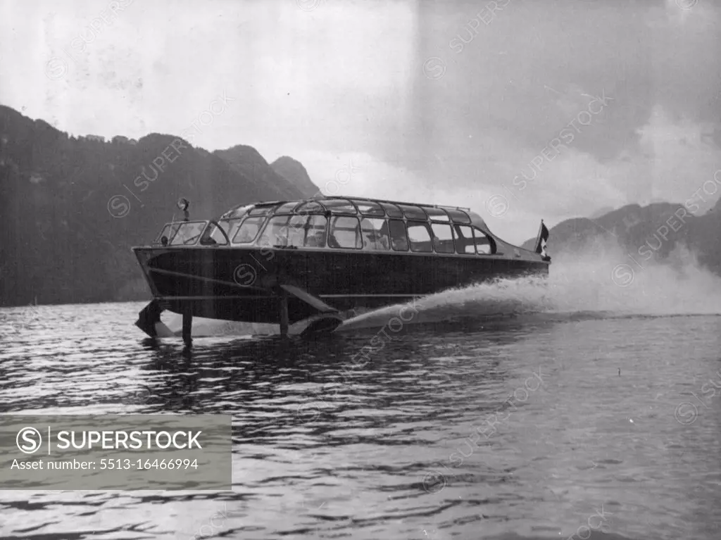 World' s Fastest Passenger Boat -- The Hydrofoil craft at speed during a demonstration run. Claimed by its inventor, Hans Von Schertel of Germany, to be the fastest passenger-carrying boat in the world, a 45-foot-long boat with wings was put through its paces on lake Lucerne, Switzerland, September 9. It covered 50 miles up and down the lake at 50 miles an hour with 32 passengers aboard. The Hydraulically-operated "Wings" lifted the main part of the craft out of the water shortly after it started, decreasing the water-drag by some 50%. The craft is powered by a 350HP diesel engine driving a normal screw. It is claimed that the boat could cross from France to Dover in rough water in only 30 minutes. September 11, 1952. (Photo by Associated Press Photo).