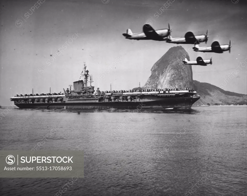 F.D.R In Rio De Janerio - The mighty aircraft carrier, Franklin D. Roosevelt, the largest naval ship afloat, is shown as she arrived here for a ten day visit. Escorted by Brazilian aircraft, the carrier steamed into the harbour with her flight deck completely covered with planes. Prior to her arrival here, the F.D.R. had been on shakedown. Sugar loaf mountain can be seen in the background. September 2, 1946. (Photo by Wide World Photos).