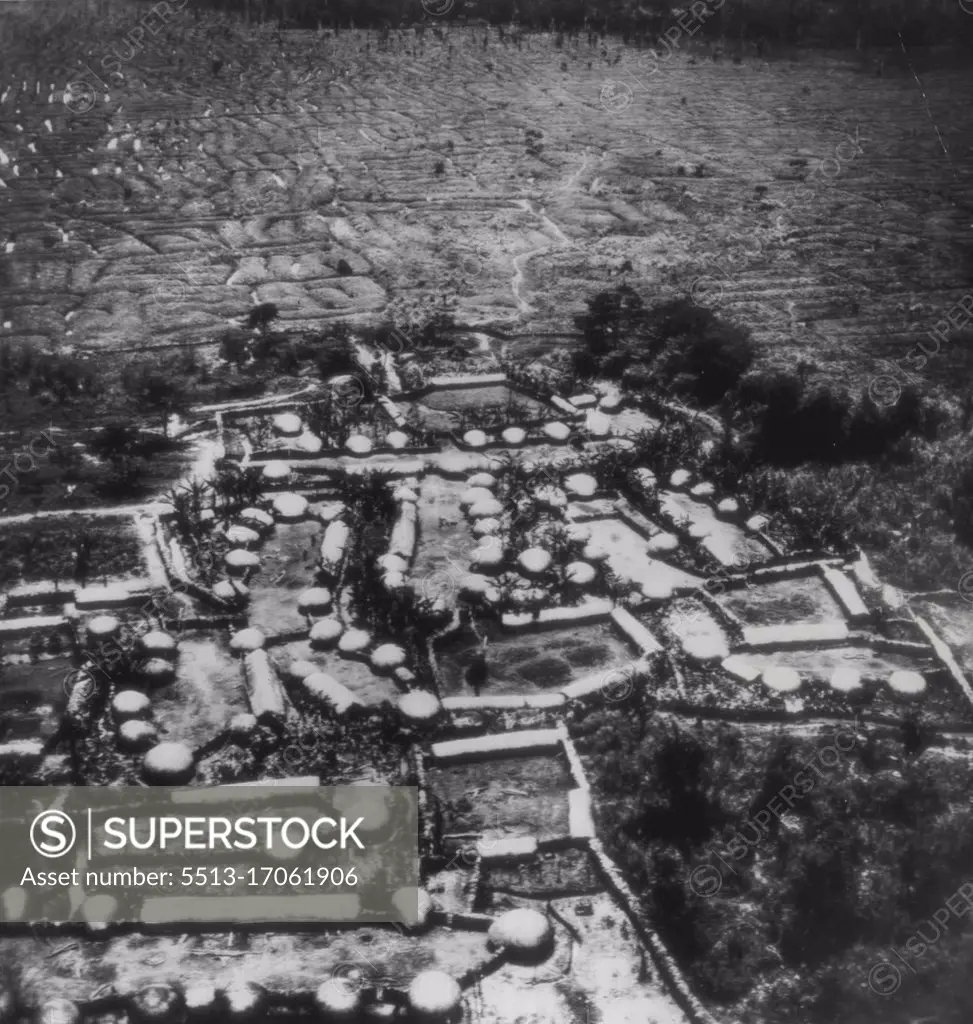 A Hidden Village In New Guinea's 'Hidden Valley" - A typical village in the "Hidden Valley of Shangri-La," Dutch; New Guinea, where efforts are being made to rescue a WAC and two army airmen, only survivors of 24 service people who crashed in a transport plane in the jungle-surrounded area 24 days ago. June 8, 1945. (Photo by AP Wirephoto). 