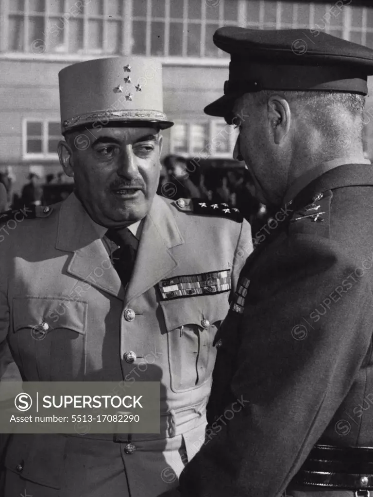 Five-Star General Augustin Guillaume, Chief of the French General Staff, welcomed by his Australian counterpart, Lieut-General H. Wells, at Essendon today. He is already known as General "Bill" by Australian officers. July 11, 1955.