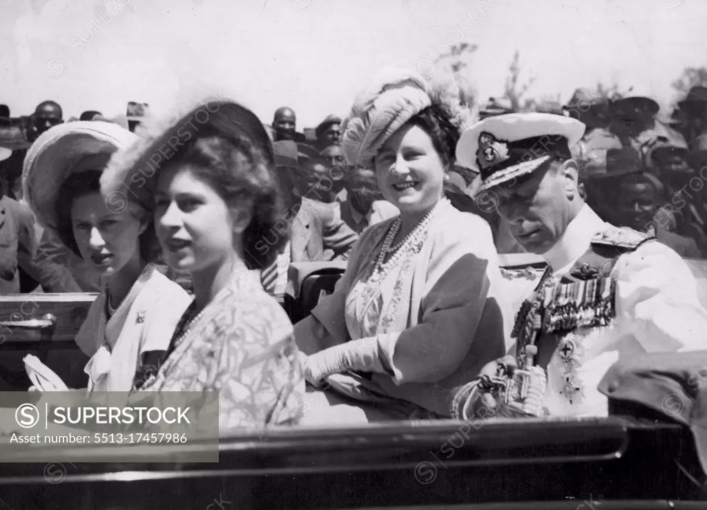 The King and Queen, Princess Margaret Rose (extreme left) and Princess Elizabeth arriving in the Royal car for the ceremonies that attended their visit to Transkei. A great host of nations, headed by their Chiefs, congregated at Umtata, Transkei, form all the Transkeian territories to pay homage to the Royal family, when they visited the native Capital, during their tour of South Africa. The King, who was wearing tropical Naval uniform, with garter ribbon and sword, presented medals to many of the Paramount chiefs, and it was here that for the first time the Royal Family heard the famous Royal salute "Beyets" - three times repeated - a resounding and impressive welcome. March 11, 1947.