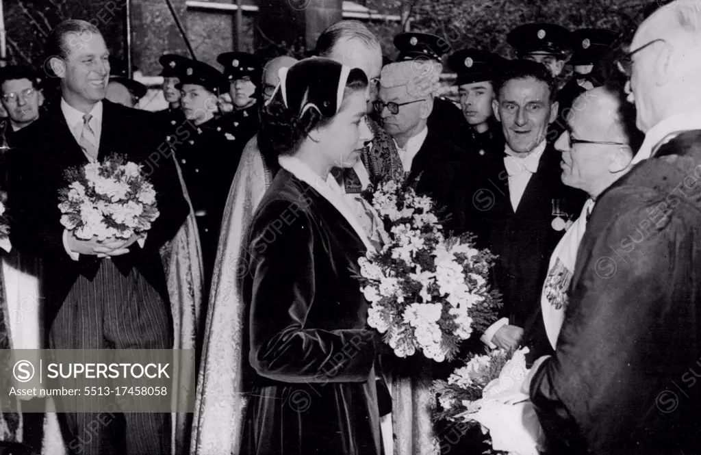 The Queen taking leave of the clergy after the service. On left is the Duke of Edinburgh. Both are seen carrying the traditional posies of Spring flowers. The Queen distributes the Royal Maundy. H.M. The Queen with the Duke of Edinburgh attended the annual distribution of the Royal Maundy Monies during the Service held this year at Southwark Cathedral, South London. during the Ceremony selected elderly and needy persons are presented with gifts commemorating each year of the Sovereign's life. April 7, 1955. (Photo by Sport & General Press Agency Limited).