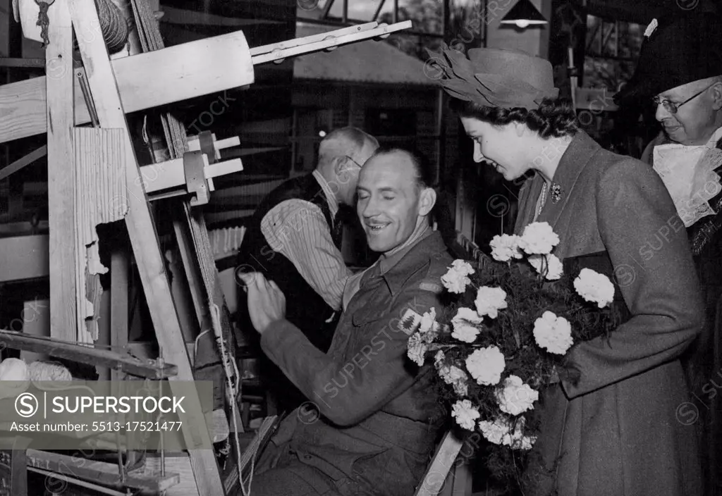 Princess Elizabeth Visits Exeter - Her Royal Highness Princess Elizabeth, on a two-day visit to Exeter, visited the St. Loyes College for the Disabled. Princess Elizabeth, wearing a new off-the face hat, trimme with sweeping laurel leaves, chats to one of the trainees - a disabled Polis soldier - during her visit yesterday (Wednesday) to the St. Loyes College for the Disabled at Exeter, Devon. November 14, 1946.