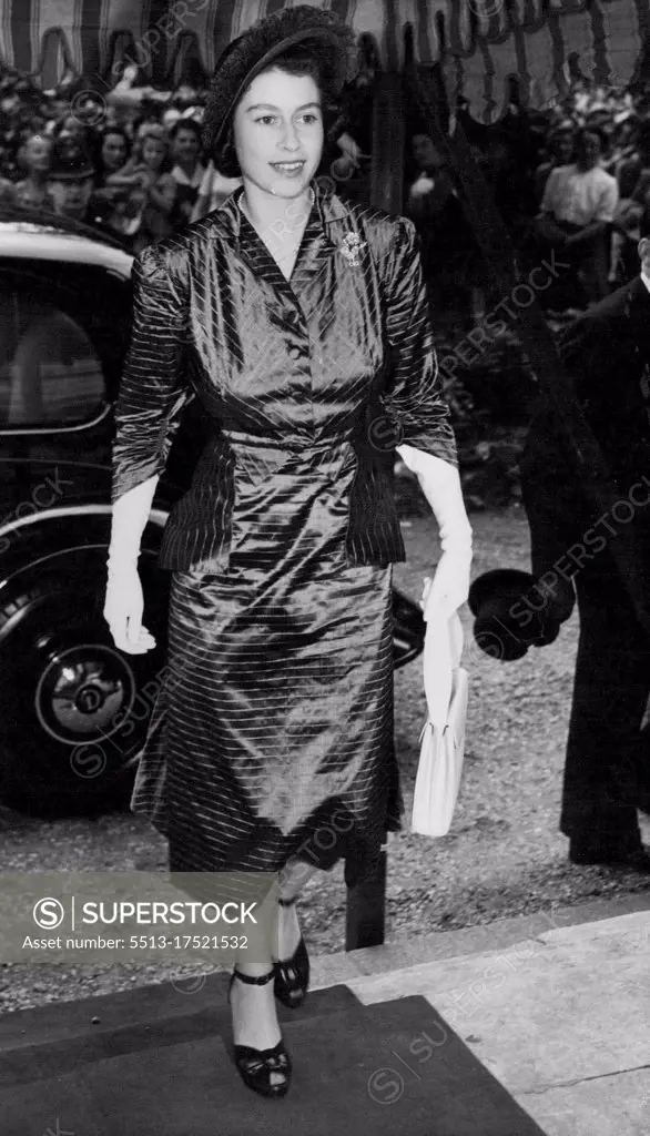 Elizabeth At London Wedding - Princess Elizabeth arriver at St. Peters church, Eaton Square London for the Wedding of one of her Bridesmaids, Lady Elizabeth Lambart to MP. Mark Longman, today. July 20, 1949. (Photo by Associated Press Photo).