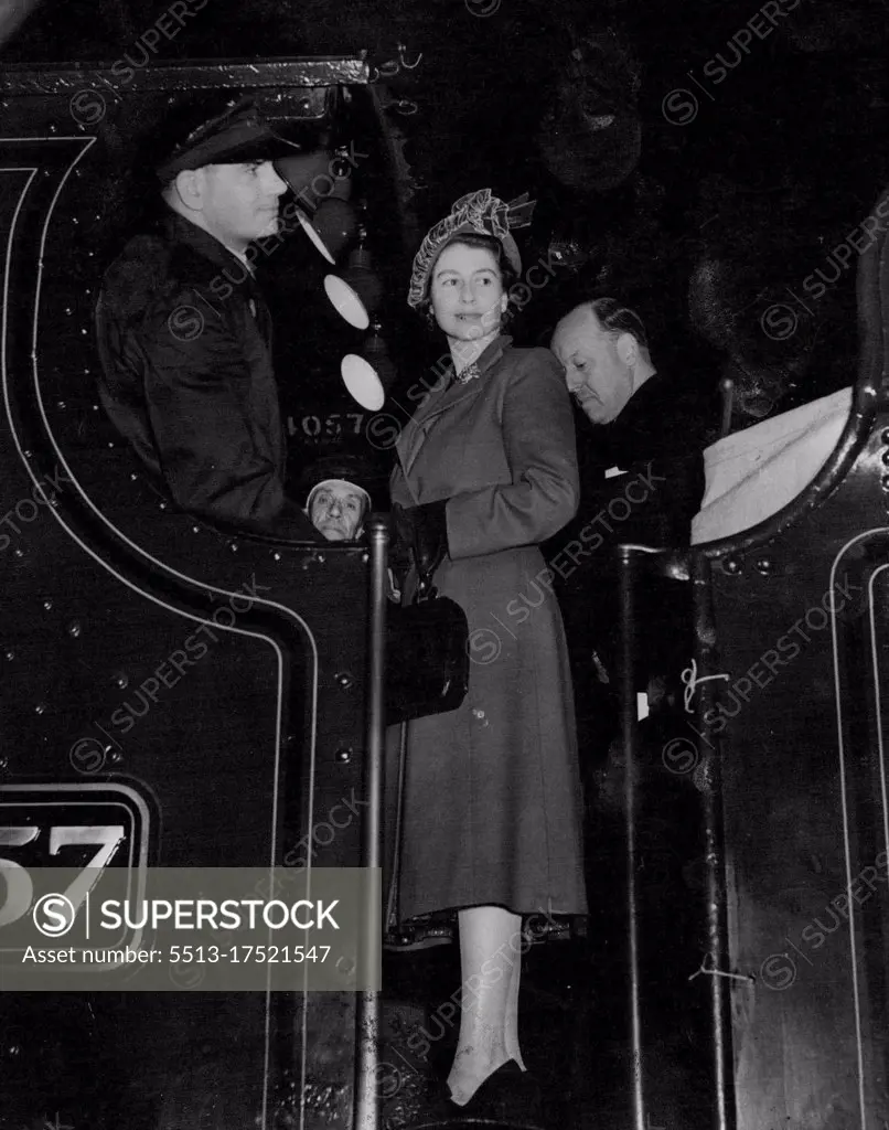 Princess Becomes Engine Driver - Princess Elizabeth standing on the footplate of an engine named after her when she visit the British Railway works at Swindon England today. She travelled on the engine from the works to Swinden station and helped to drive it during the journey. November 15, 1950.