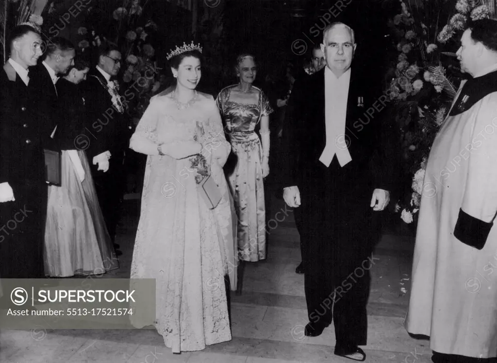 The Queen At Lloyd's - The Queen, wearing a gown of ivory lace over peach-coloured taffeta, is seen when she visited Lloyd's to lay the foundation stone of a new, £2, 000,000 Lloyd's building. On arrival the Queen, who was accompanied by the Duke of Edinburgh, was met by Mr. Matthew watt Drysdale, Chairman of Lioyd's. November 7, 1952.