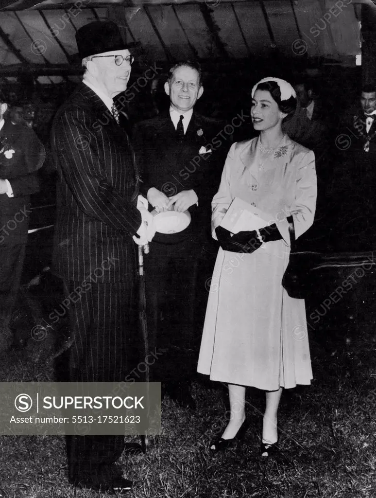 Queen Meets King -- The Queen chats with King Gustav Adolf of Sweden during her tour of the Chelsea Flower Show in the ground of the Royal Hospital, Chelsea, London, to-day (Tuesday). In centre is the Hon David Bowes-Lyon, uncle of the Queen and President of the Royal Horticultural Society. May 24, 1955. (Photo by Reuterphoto).