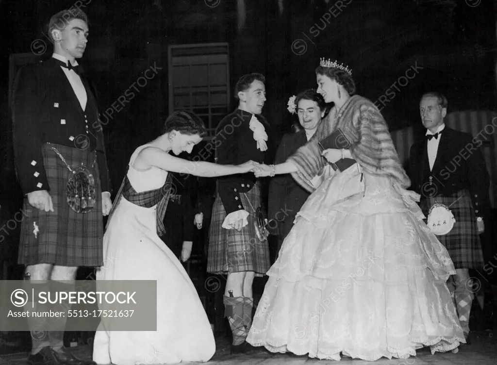 Scottish Dancers Presented To Queen -- Miss Allie Anderson presents country dancers to the Queen at the palace of Holyroodhouse during a concert held at the palace near Edinburgh on June 28. On the right is the Duke of Hamilton. Her Majesty is paying a six-day visit to Edinburgh. June 30, 1952.