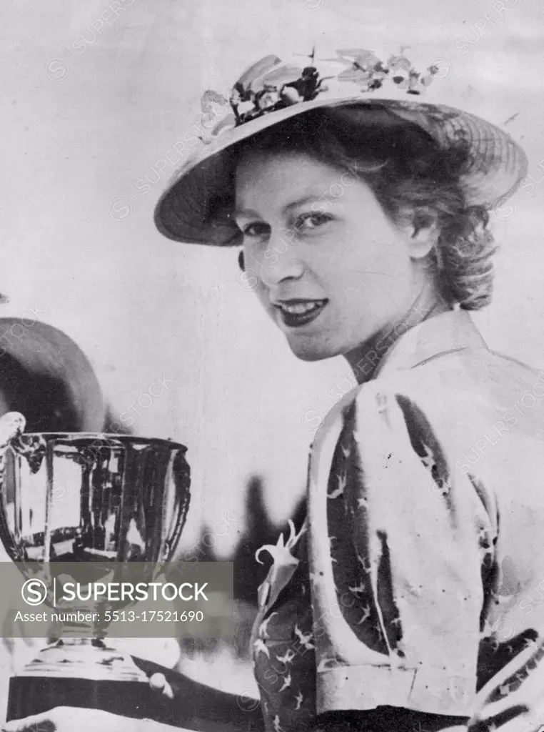 Princess Elizabeth Wing Horse Show Cup Princess Elizabeth (Above), of Great Britain, holds the cup she won in the private driving class for the best turn-out at the Windsor Royal Horse Show, March 27. January 6, 1944. (Photo by Associated Press Photo).