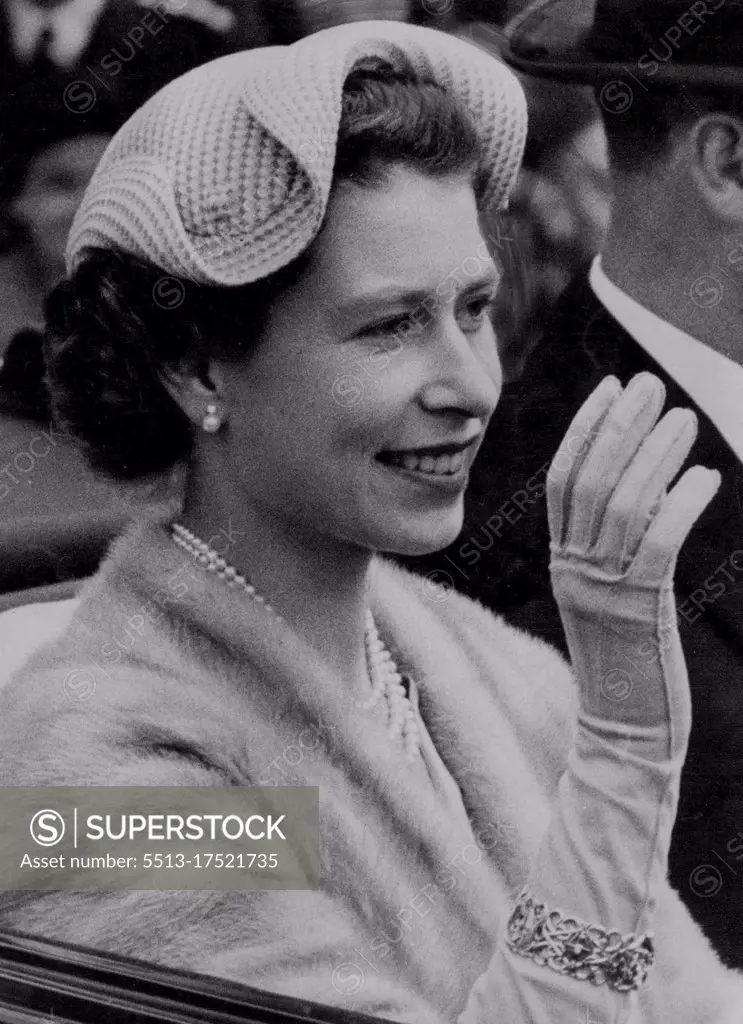 The Queen's Last Day Fashion The Queen, smiling and wearing an attractive white wavy-edged hat, drives along the Ascot course with the Duke of Edinburgh on this final day of the Royal meeting. June 18, 1954.