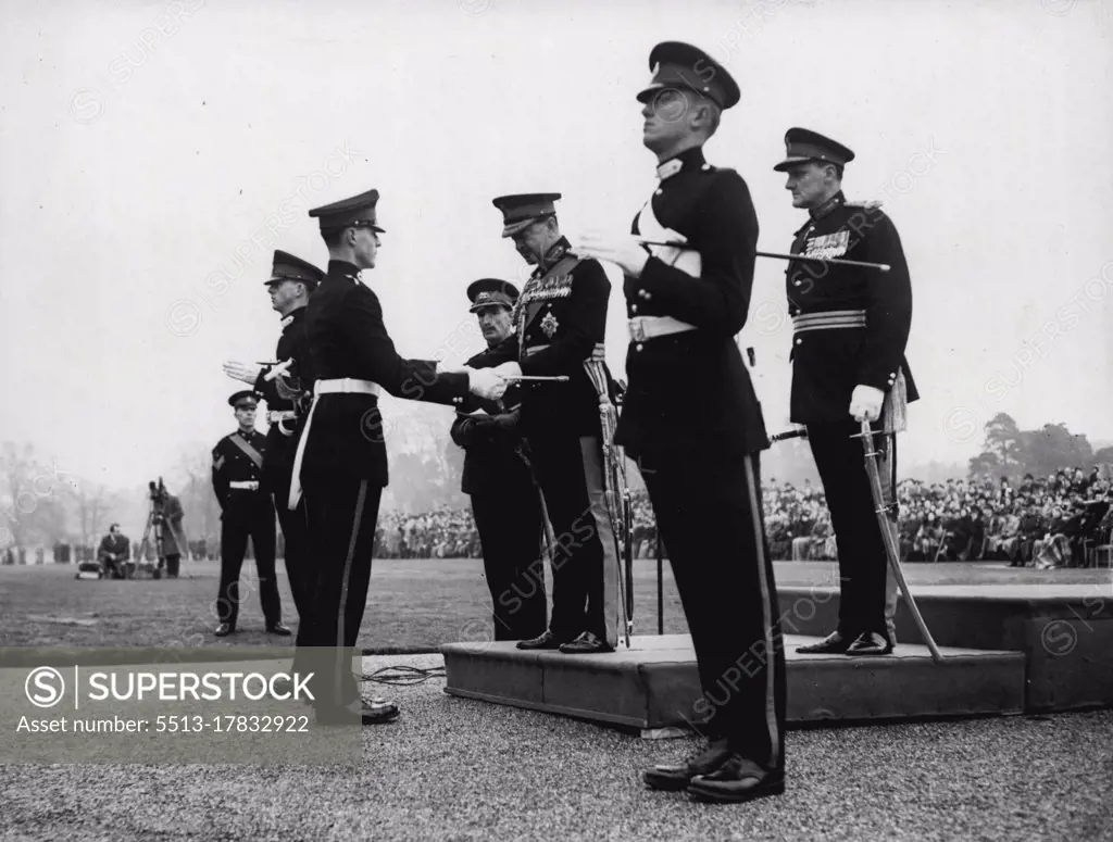 The Sovereign's Parade At Sand Hurst: Field Marshal the Earl Alexander of Tunis Presents the Sword of Honour to Senior Under Officer Lord P.T. de la P. Beresford, heir Presumptive to the Marquessate of Waterford, at the Sovereign Parade at the Royal Military Academy at Sand Hurst today. February 11, 1953.