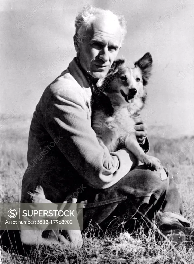 Ernie Pyle And His Dog -- Ernie Pyle and his Shetland Sheep dog Cheetah Sun Themselves on the Mesa outside his home in Albuquerque, N.M. after the Noted Correspondent and Author returned from the European Theater of Operations. Pyle was reported April 18 to have been Killed in on Ie Jima, Northwest of Okinawa, by a Japanese Machine gun gullet. April 18, 1945. (Photo by Bob Landry, Associated Press Photo).