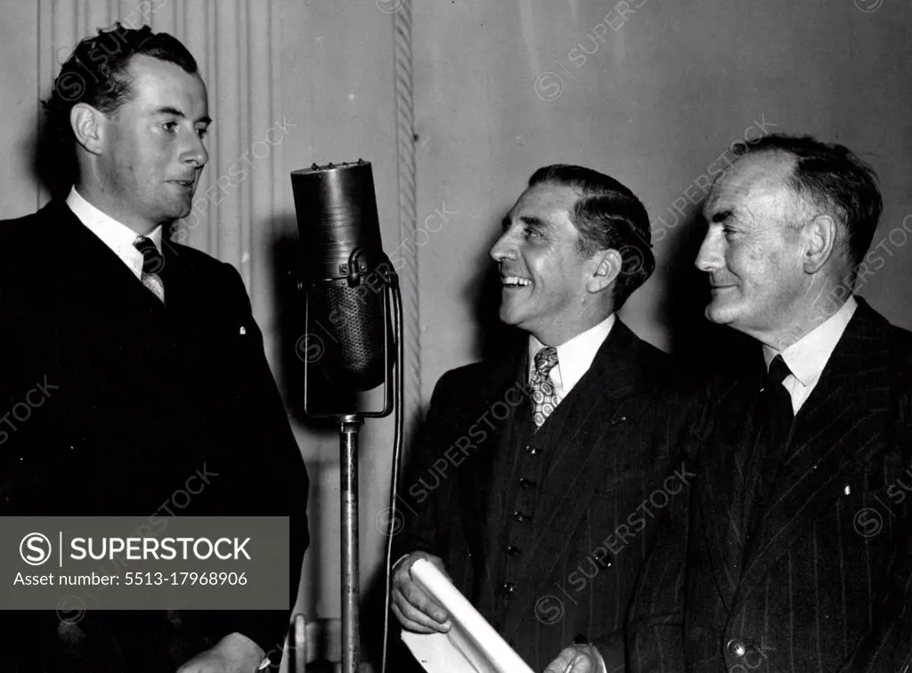 Security Loan Quizmaster, Walter Pym, waiting for an answer to a question put to Mr. E. G. Whitlam which qualified him to take part in the next round of the Quiz on October 1. The other successful contestant, Mr. I. F. Jones, looks on. November 03, 1948.