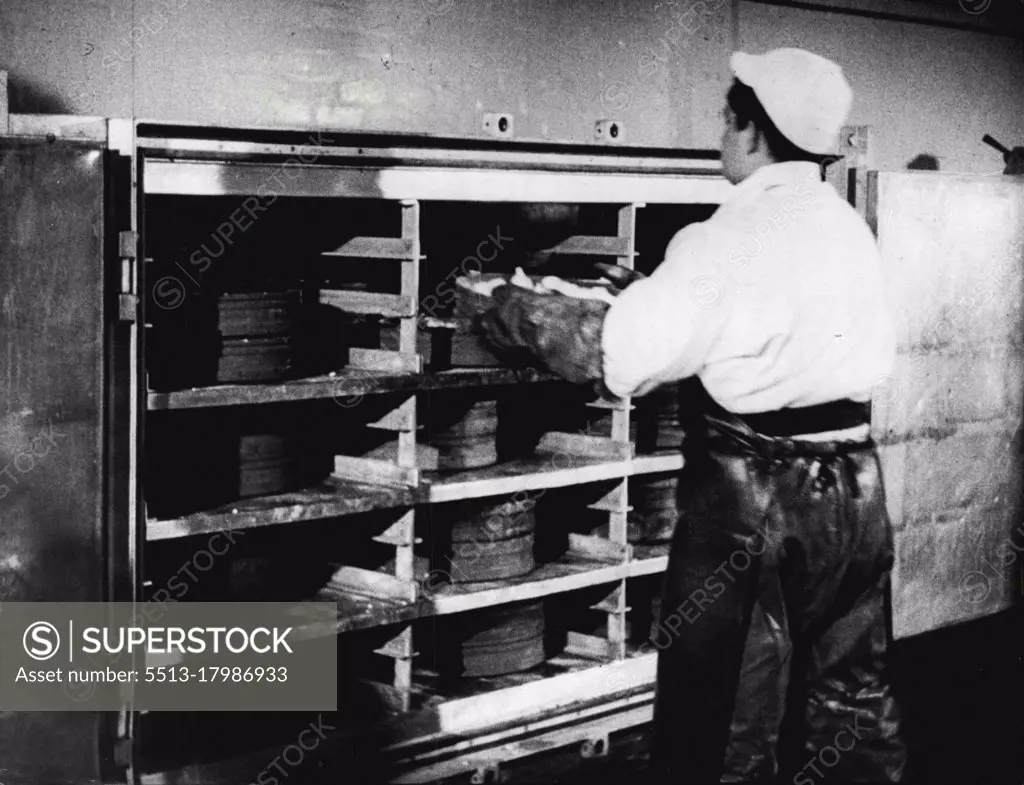 Record Order From Britain's Atomic Industry.Loading trays containing ammonium diuranate, raw material of nuclear fission, on to trolleys at Springfield. From the trolleys, the trays are placed in the GEC Furnaces, resulting in the formation of solid uranium tetra fluoride.Details have been released today (Monday) of an order for atomic equipment worth about $500,000 placed by the Ministry of Supply with the General Electric Co. Ltd.The equipment is for use in the conversion of pure ammonium diuranate to metallic uranium and these pictures show some of the plant in use at the Ministry's Spring field factory near Preston, Lancashire. April 5, 1954.