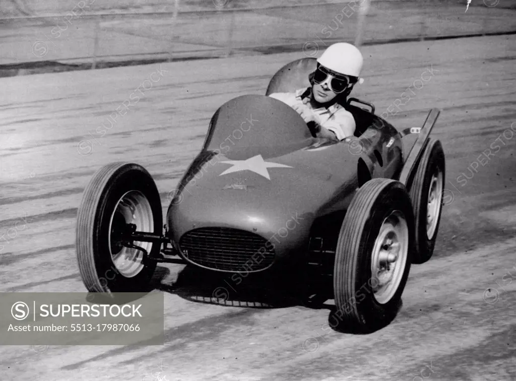 The Atom Racer -- Ronnie Moore, World speedway champion, 1954, speeds round the Wimbledon, London, track in the world's smallest racing car, prototype of a fleat expected to be racing in Britain next year.The car, styled atom-Car is powered by a 500 c.c. Speedway J.A.P. engine, In the first trial of the car the year, the machine over turned and Moore broke his collar-bone. Considered adjustment have since been made to the car. September 20, 1955. (Photo by Reuterphoto).