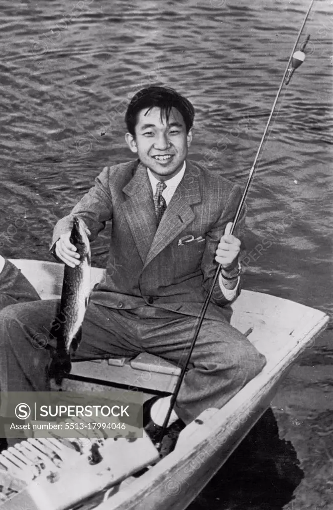 Crown Prince Lands Fish -- The Crown Prince Akihito of Japan smiles holding a 16-inch pickerel he caught while fishing on Naushon Island, off Woods Hole here today. The 19-yr-old Prince proved himself an expert fisherman during the short rowboat trip catching the pickerel, a bass, a perch and three turtles. The Crown Prince's two-day Massachusetts trip will end tomorrow after a visit to Harvard University and a sightseeing tour of Boston. September 20, 1953. (Photo by AP Wirephoto).