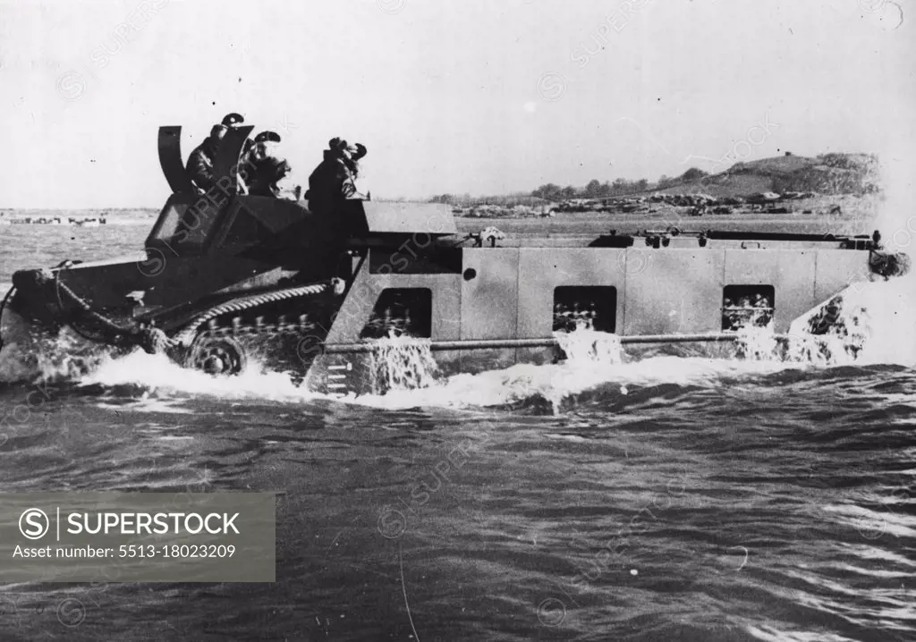 The Neptune Amphibious Tank -- "Neptune" putting out to sea. This British tracked amphibious vehicle is a ship-to-shore load carrier capable of self-propulsion in any sea, able to land on a beach through heavy surf, and to move across country. "Neptune" can take a pay load of approx; four tons and has a large unobstructed hold, which makes it particularly suited for the carriage of a wide variety of equipment, including the 17-pounder anti-tank and 25 pounder filed guns, vehicles, casulaties, and stores. "Neptune" is equipped with navigation lights in addition to normal road lamps, a wireless  set operated by the driver's mate. October 27, 1945. (Photo by Central Press Photos Ltd.).