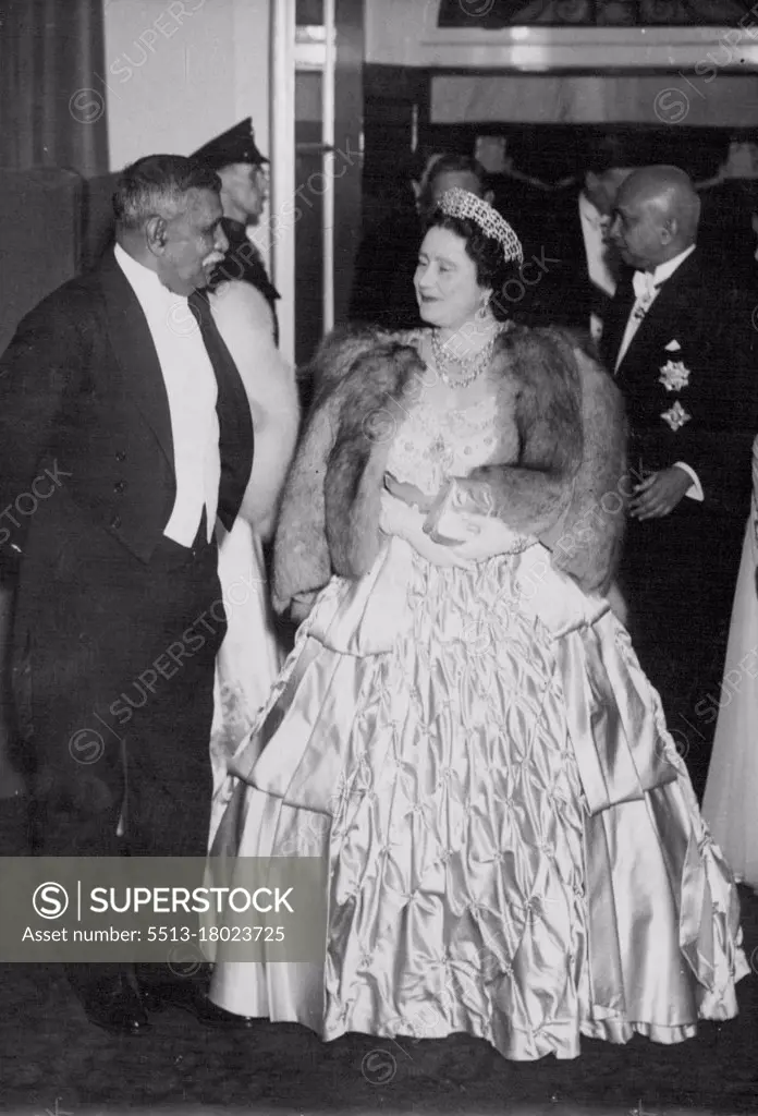 British Commonwealth History Made - H.M. The Queen with the King just behind her arriving at the reception this evening. On the left is Don Senanayake, Prime Minister of Ceylon, and on right is Sir Oliver Goonetilleke, High Commissioner for Ceylon.When The King and Queen attended a reception to-night, given by the High Commissioner for Ceylon, Sir Oliver Goonetilleke, British Commonwealth history was made for it was the first social occasion of its kind given by one of the three youngest dominions and graced by the presence of the King and Queen. October 27, 1948. 