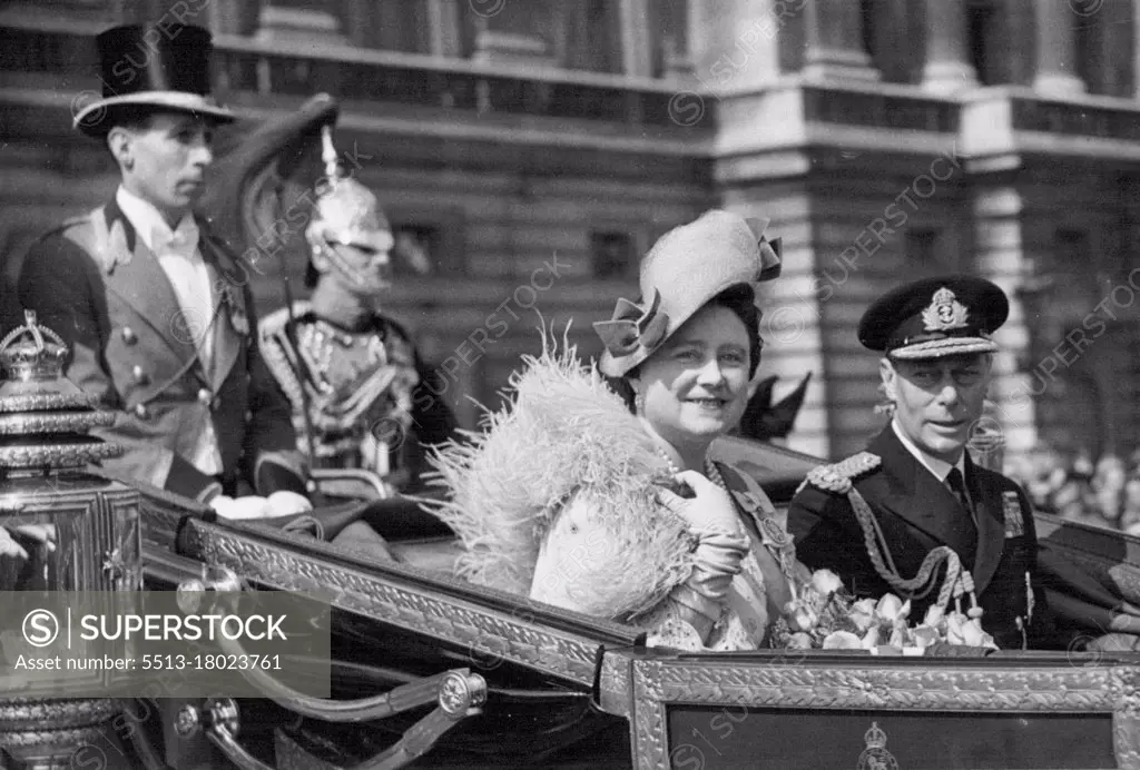 Silver Drive In Golden Sunshine -- T.M. The King and Queen in their laundau during their silver wedding drive this morning.The King and Queen drive to St. Paul's Cathedral for their Silver wedding service through a vast mass of people gathered to cheer and congratulate Their majesties. April 26, 1948.