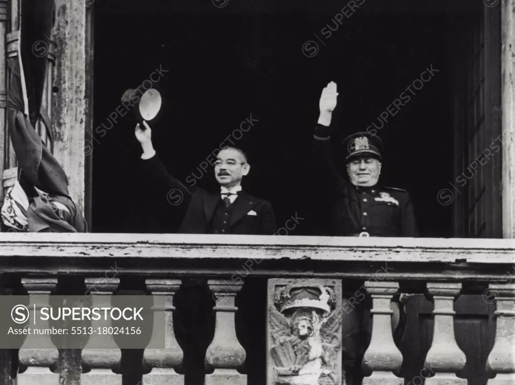 Salute From Palazzo Venezia - Japanese Foreign Minister Yosuke Matsuoka (left) waves his silk hat and premier Benito Mussolini of Italy, gives the fascist salute from balcony of the Palazzo Venezia during Matsuoka's visit to Rome on April 1. April 15, 1941. (Photo by Associated Press Photo).