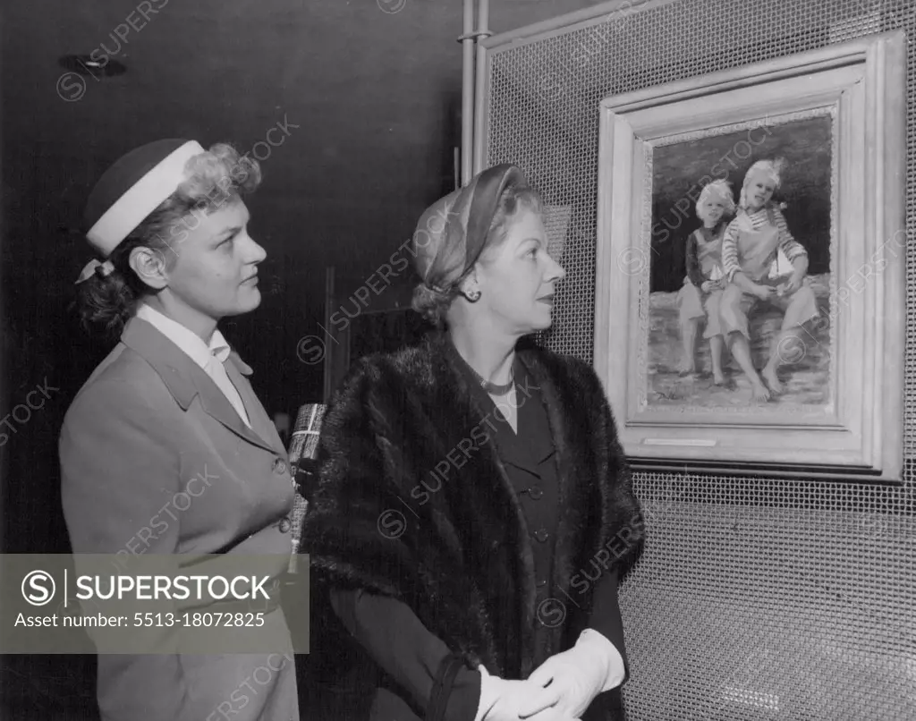 Lady Spender, wife of Sir Percy Spender, Australian Ambassador to the United States, and the Australian artist, (Mrs.) Dale Collings, looking at the latter's portrait of the two Collings children. April 1, 1953.