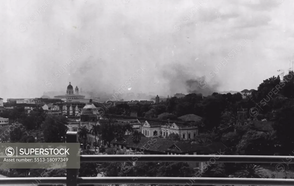 Smoke haze over Singapore. Damamge done by Japanese bombing. February 19, 1942.