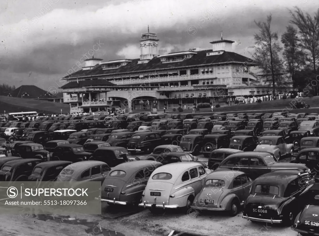 Giant tow decker stand at Singapore Turf Club racecourse with parking area in foreground. Picture shows beautiful lawns and trees at entrance to course. December 01, 1950.