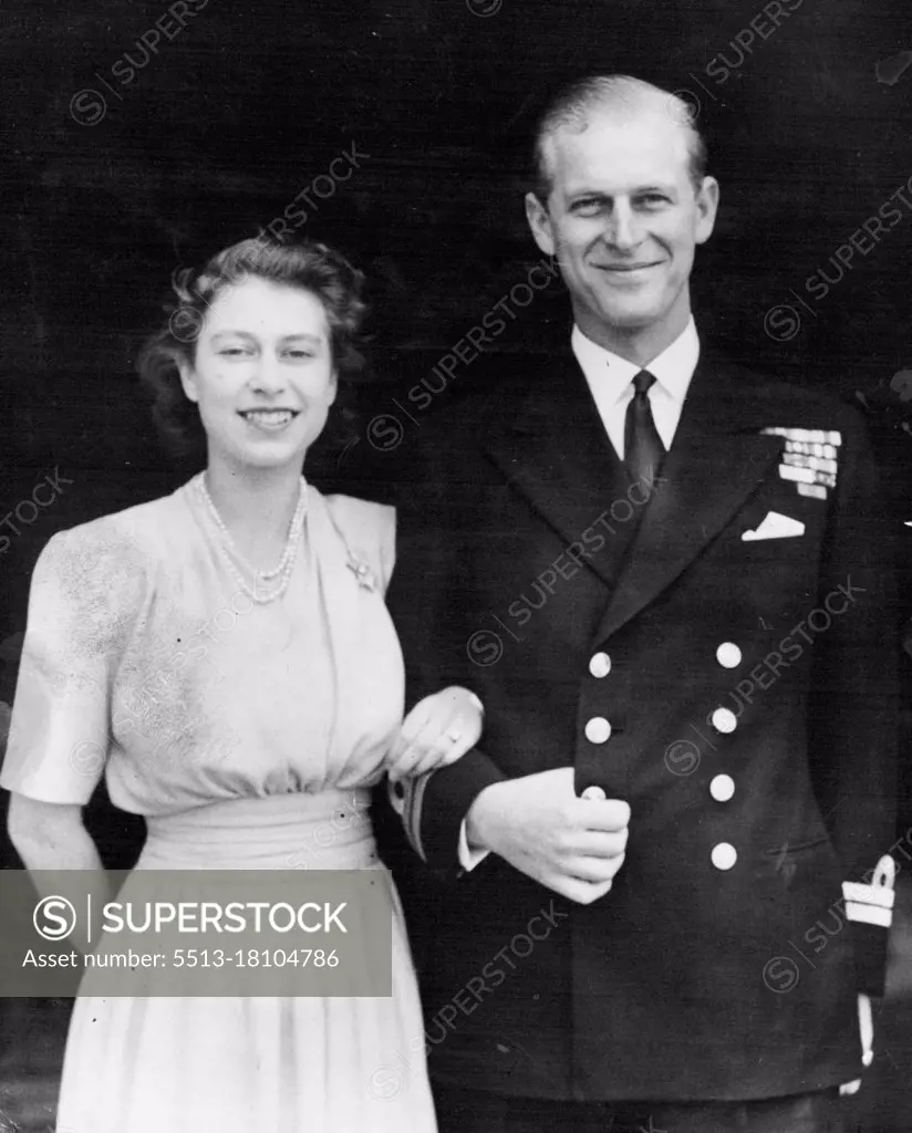 First Royal Engagement PictureSmiling happily, the Princess and her fiance are pictured on the terrace at Buckingham Palace to-day (Thursday).H.R.H. Prince Elizabeth and Lieut. Philip Mountabatten, R.N., whose engagement is announced today, posed for their first engagement pictures at Buckingham Palace today (Thursday). For the pictures she wore a dress of yellow daffodil silk, and the lovely diamond of her engagement ring, flanked on each side by baguette diamonds, gleamed in the soft light. July 10, 1947.