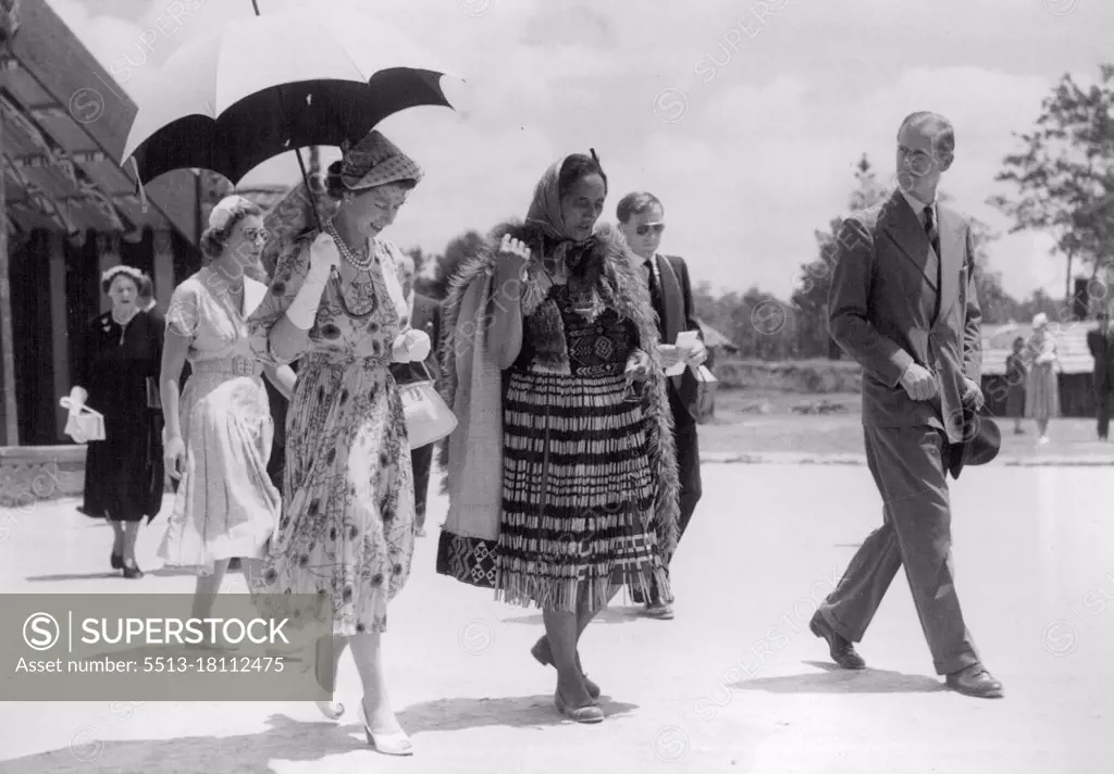 Queen Elizabeth and the Duke of Edinburgh with Ranji, famous Maori Guide, inspecting the Maori land at the Reserve, Rotorua. January 11, 1954.