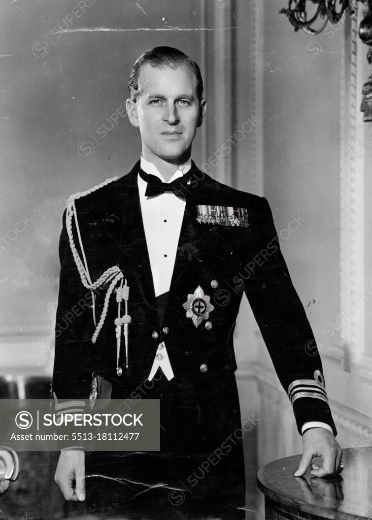 H.R.H. The Duke of Edinburgh -- This Portrait study shows his Royal Highness in the drawing room of Clarence House, wearing the mess dress of the Royal Navy with the sash and insignia of the order of the Garter. June 13, 1952. (Photo by Baron, Camera Press)