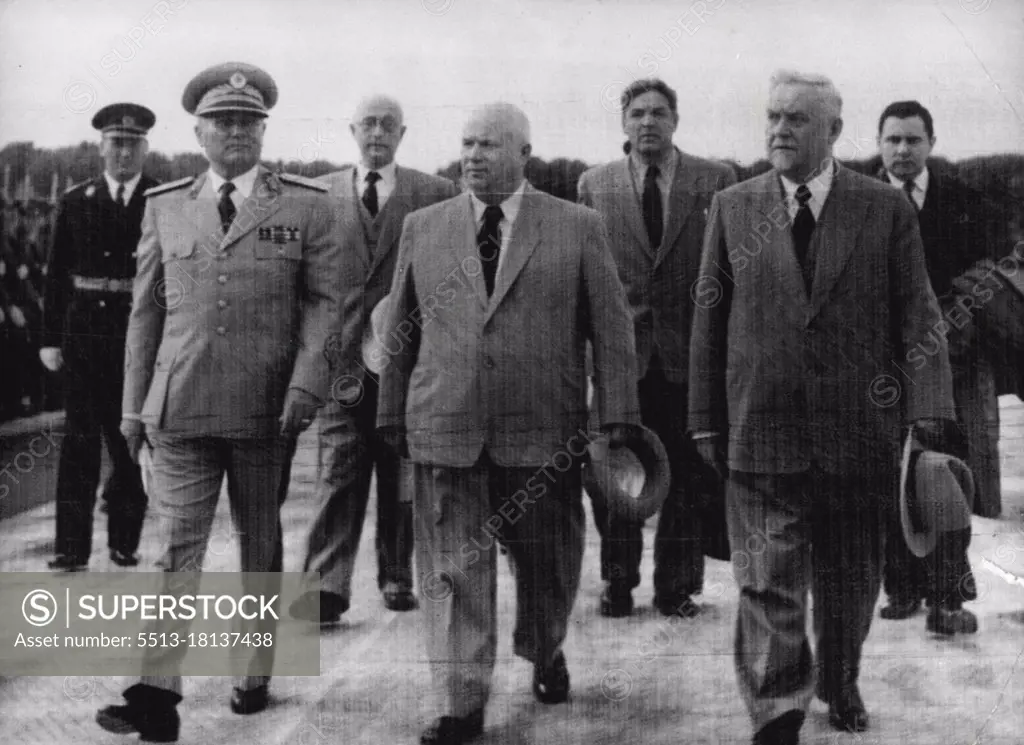 All In Step -- Every Body's in step as Marshal Tito of Yugoslavia, left, Marches with his soviet guests across Tarnac at Belgrade Airport after they hall arrived on a friendship visit to Yugoslavia today, May 26. Nikita Khrushchev, secretary of the Russian visiting delegation at right is the Soviet Prime Minister, Marshal Nikolai Bulganin. At right in the second row is Andrei Gromyko, Deputy Foreign Minister. May 26, 1955. (Photo by Associated Press Photo).