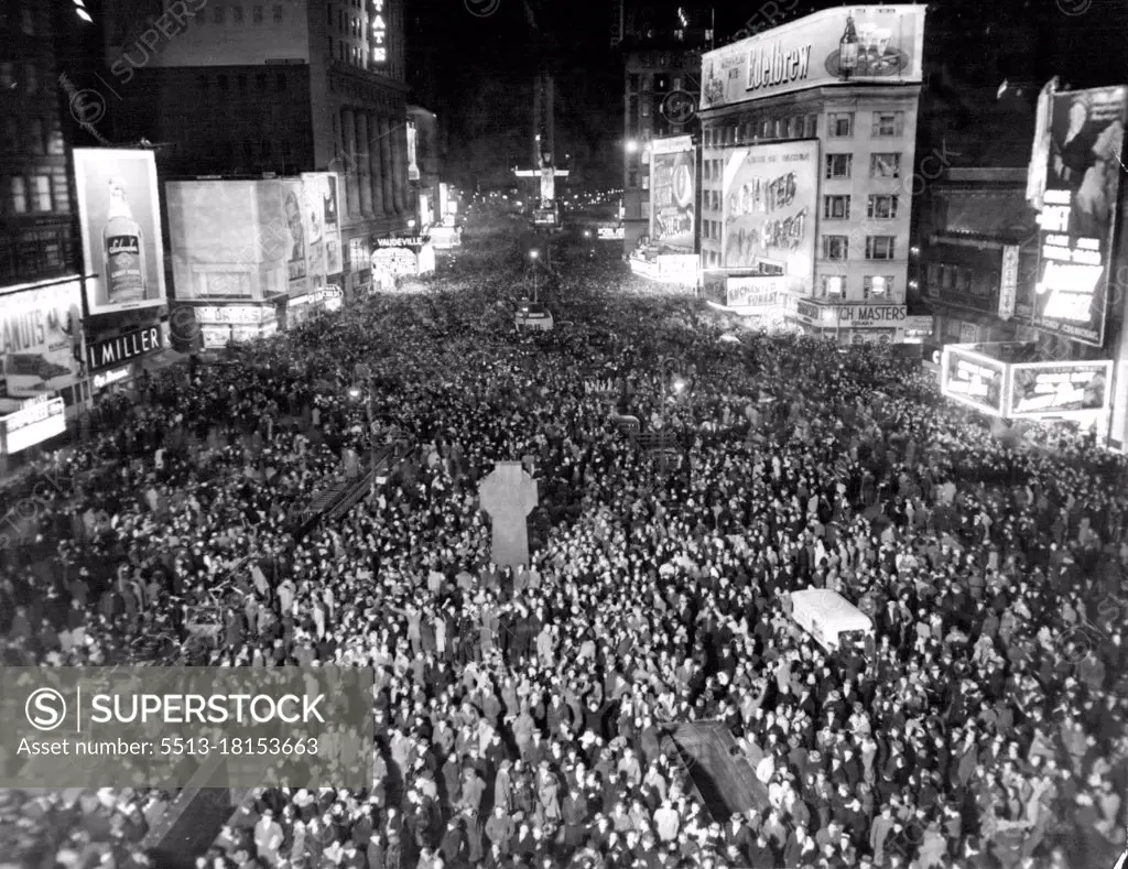 Times Square Throng Hails New Year.This Picture of Jam-Packed Times Square in New York was made exactly at Midnight Dec.31 as New Yorkers Thronged the "White Way" to welcome 1946. The view is from 47th street and Broadway, looking south. January 1, 1946. (Photo by Associated Press Photo).