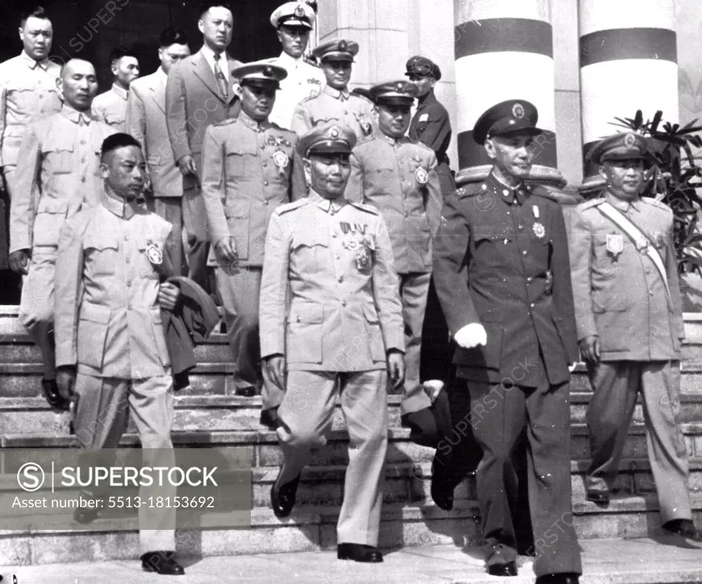 China Kai-Shek And Aides - This recent picture of Generalissom Chiang Kai-Shek (foreground) shows the Nationalist China president leading group of his officers down steps of Ministry of National Defense ***** in Taipei, Formosa, Occasion for the picture received in United States Sunday, was not explained in U.S. Army caption accompanying it. Officers were not identified. February 9, 1953. (Photo by AP Wirephoto).