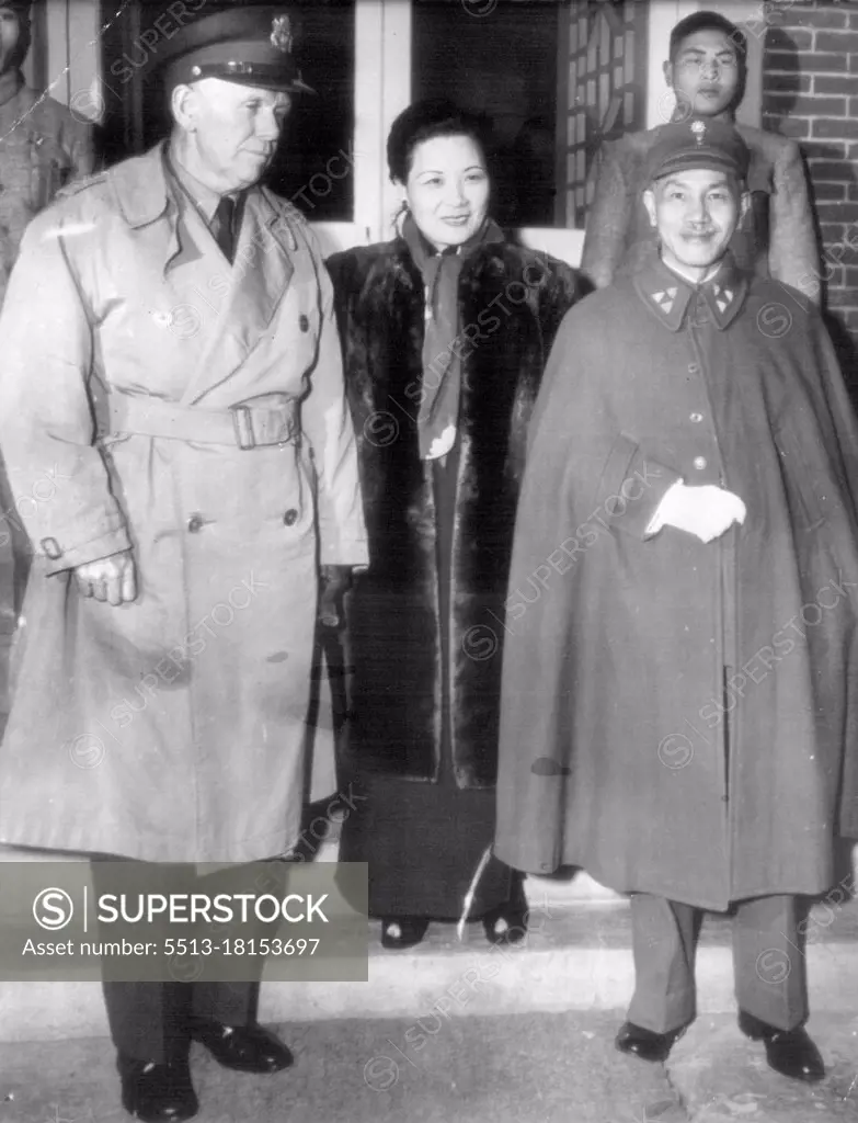 Marshall Visits Chiangs ***** - Gen. George C. Marshall (left), special envoy to China, poses on the steps of the Nanking residence of Generalissimo, Chiang Kai-Shek with his host, the Generalissimo (left) and Madame Chiang (center), shortly after his arrival at Nanking. December 28, 1945. (Photo by AP Wirephoto).