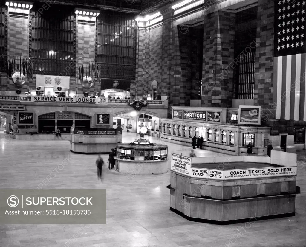 New York Night Life -- ***** main waiting room at Grand Central ***** is almost deserted at 3:05 A.M. Only one window is open for ticket sales.In about three hours another commuters' rush will begin. June 20, 1946. (Photo by Wide World Photos).