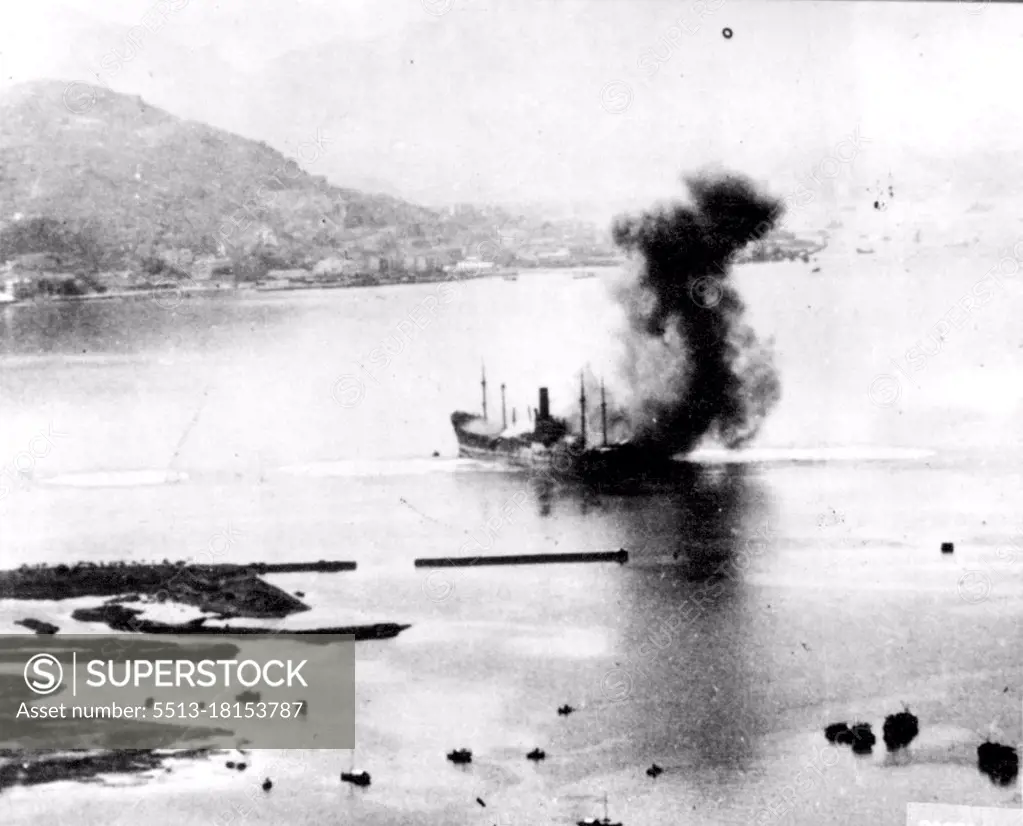 Jap Ships Burns In Hong Kong Harbor -- Mitchell medium bombers of the 14th army air force swooped over Hong Kong harbor scoring hits on this 520-foot Japanese merchant ship and left ***** burning amidships with smoke pouring. From it fore and aft of the bridge. January 21, 1944. (Photo by Associated Press Photo).