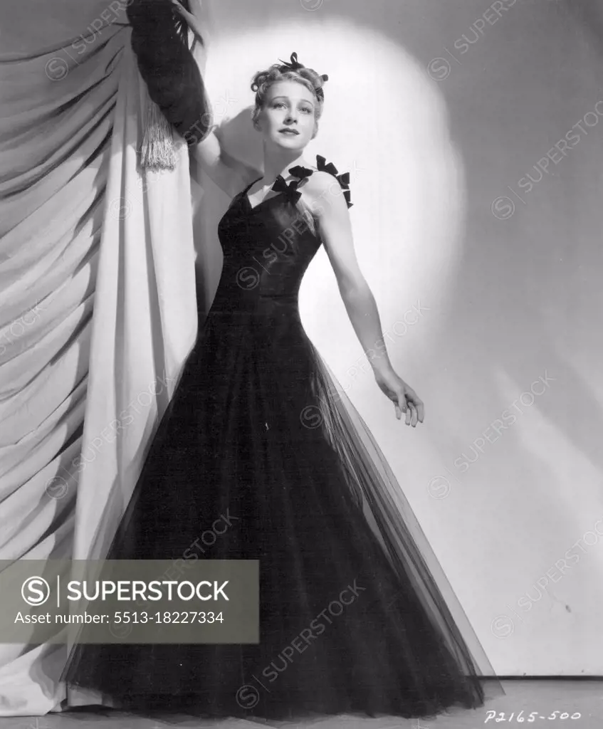 Black Tulle makes a romantic evening gown for Shirley Ross in