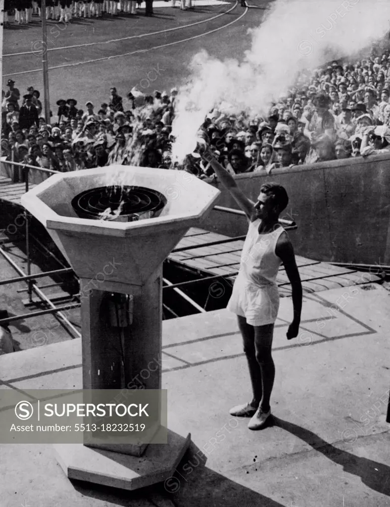 XIV Olympic Opens -- The mystery of the torchbearer who was to carry the final torch, ended when John Mark, a Cambridge Athletic blue arrived at the Wembley Stadim at 3.50 to perform the ceremony of lighting the Olympic Flame at the Opening of the 1948 Olympic Games. July 29, 1948. (Photo by Reuterphoto).