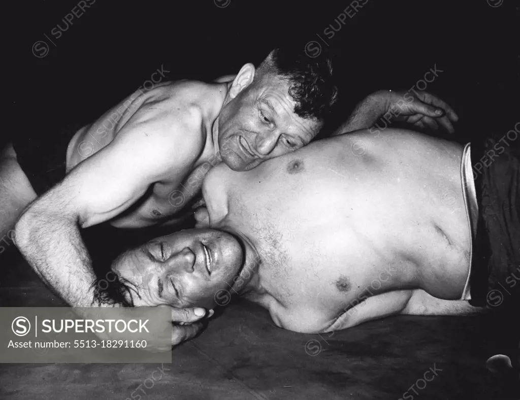 Wrestlong - Olympic Trials - J. Wilson (Dunfermline) and T. Baldwin (S. Forresters A.W.C) pictured during their middleweight bout in the British Amateur Wrestling Championships and final Olympic Trjals at Harringay today. May 16, 1952.