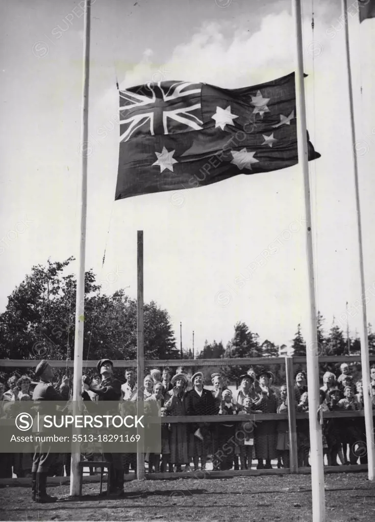 Australian Flag Raised at Helsinki - Finnish soldiers hoist the Australian flag in a ceremony at the Olympic village, near Helsinki, July 15. July 17, 1952. (Photo by AP).