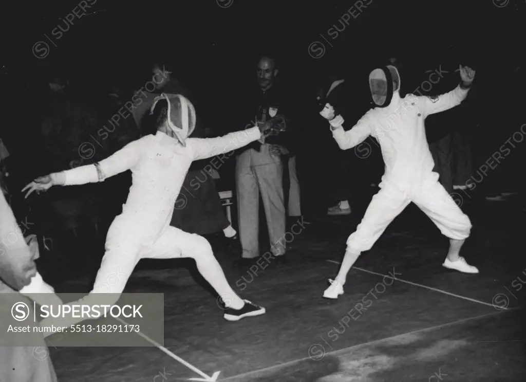 Olympic Team Foils Fencing - Sven T. Fahlman of Sweden (left) and Charles Stanmore of Australia are seen in action during the first round of the Olympic foil (team) event at the Westend, Helsinki. July 22, 1952. (Photo by AP).