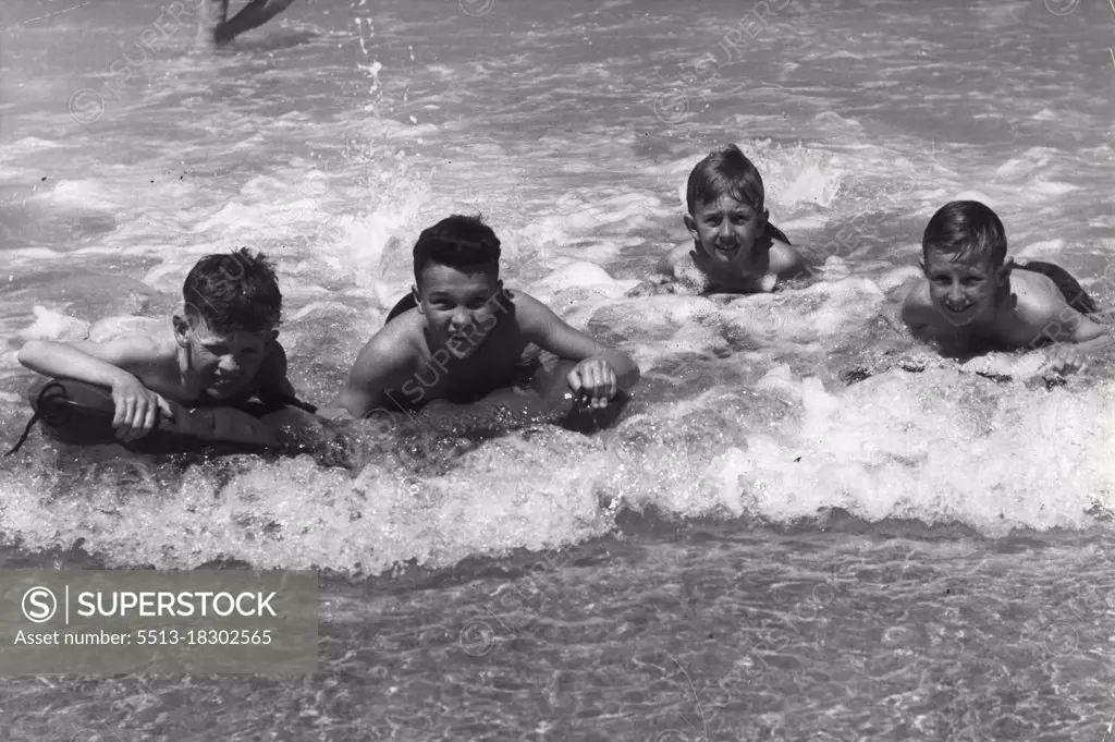 Beaches - L-R John Feeney (10) - Denis O'Connell (11) Robert Shelle (9) and Geoffrey Ture (9) all of Bondi on their surf-o-planes at North Bondi today.October 16, 1955. (Photo by Frank Albert Charles Burke/Fairfax Media).