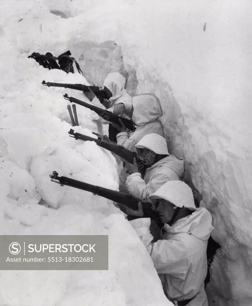 Swiss Ghost Soldiers.10,000 feet up the Mountains with the Swiss Skiing Troops.Manning a snow trench. Thanks to their white coverings, the men are only visible at close quarters. August 21, 1943. (Photo by Paul Popper; Hans Steiner Bern).