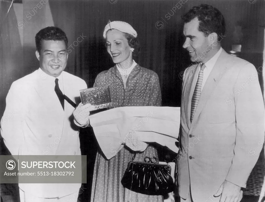 Royal Gift For Mrs. Nixon -- Vice President and Mrs. Richard Nixon admire a chiseled silver box presented to Mrs. Nixon by King Norodom, left, of Cambodia during recent visit by the Nixons to the royal residence at Siam Reap. Cambodia is an independent state in Indochina. November 11, 1953. (Photo by AP Wirephoto).