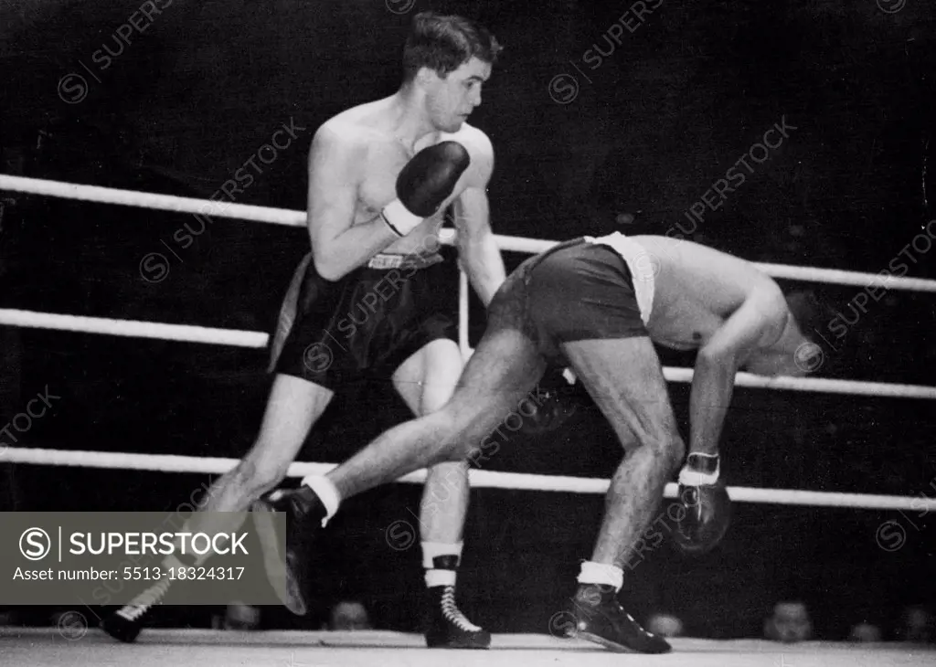 Sands Outclassed By American -- Dave Sands almost pitches through the ropes during the fight.Dave Sands, Half-Aborigine holder of the Australian triple crown in the middle, crusiser and heavyweights, was outclassed and beaten on points by American Tommy Yarsz in their ten-round fight at the Harringay Arana, North London.Before the match, Sands had been heralded as a world-beater. April 05, 1949.