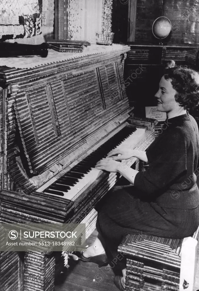 News 'Heat" - In The Paper House -- Joan Crayson, a visitor plays the newspaper piano at the Stepman house. The piano has wooden frame but the paneled veneer is made of rolled newspaper. Don't know what to do with old newspapers why not follow ***** Elis and ***** Stenman of Pigeon Cove, Massachusetts.U.S.A - build a house!Back in 1922, they began collecting newspapers in a big way. Three years and was complete. Working from a base of wooden floors, foundations and beans, the Stenmans completely enclosed the frame structure with newspapers. Large sheets were folded and glued to form paper building blocks some 215 pages ***** these were coated with preservative *****.  Then, the Stenmans became ambitious; furniture was next on the list. July 01, 1954. (Photo by Reuterphoto).