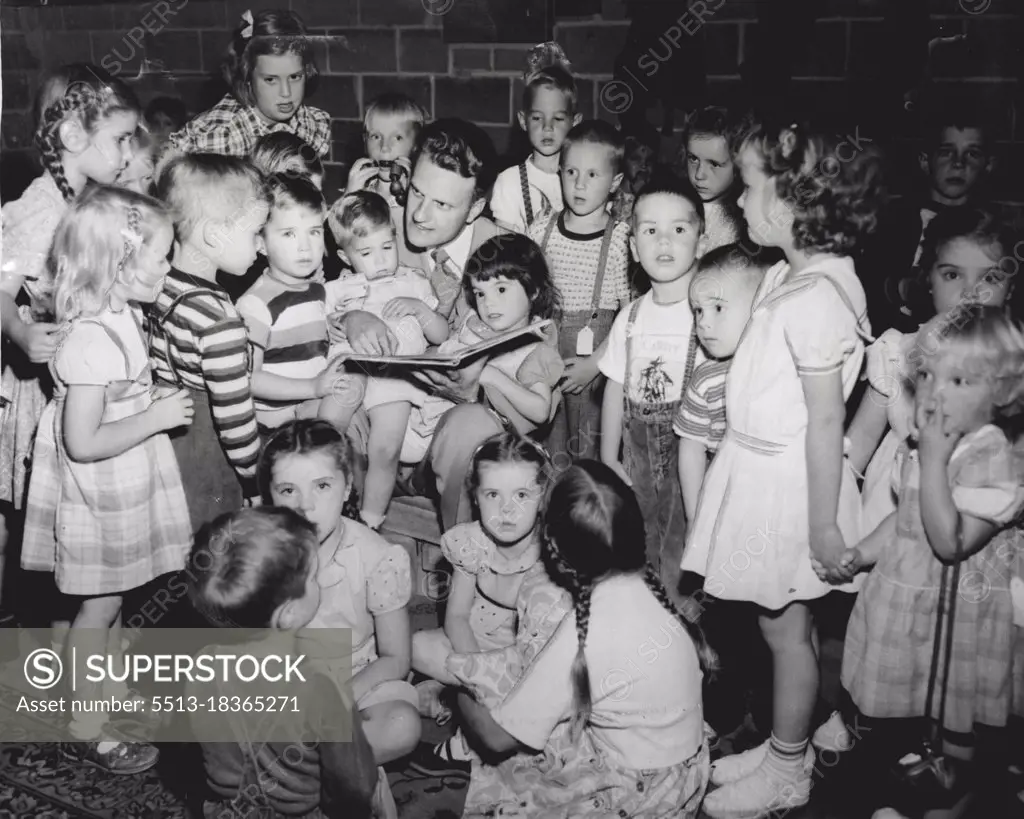 The Rev. Billy Graham and Children in Nursery where racket was plentiful and youngsters high spirited.Twenty-four of 25 babies cried lustily in their cribs in a darkened room in the High School Memorial Stadium last night.The one quiet baby-just a month old - was held in the arms of Mrs. Margaret Jessup, one of the women who tend the nursery, which has been provided for parents attending the Billy Graham revival meetings.In addition to the infant section, there is an adjoining room for children from 2 to 6. This room had a population of nearly 60 youngsters last night. The noise, however, was more of the high-spirited type. April 15, 1955.